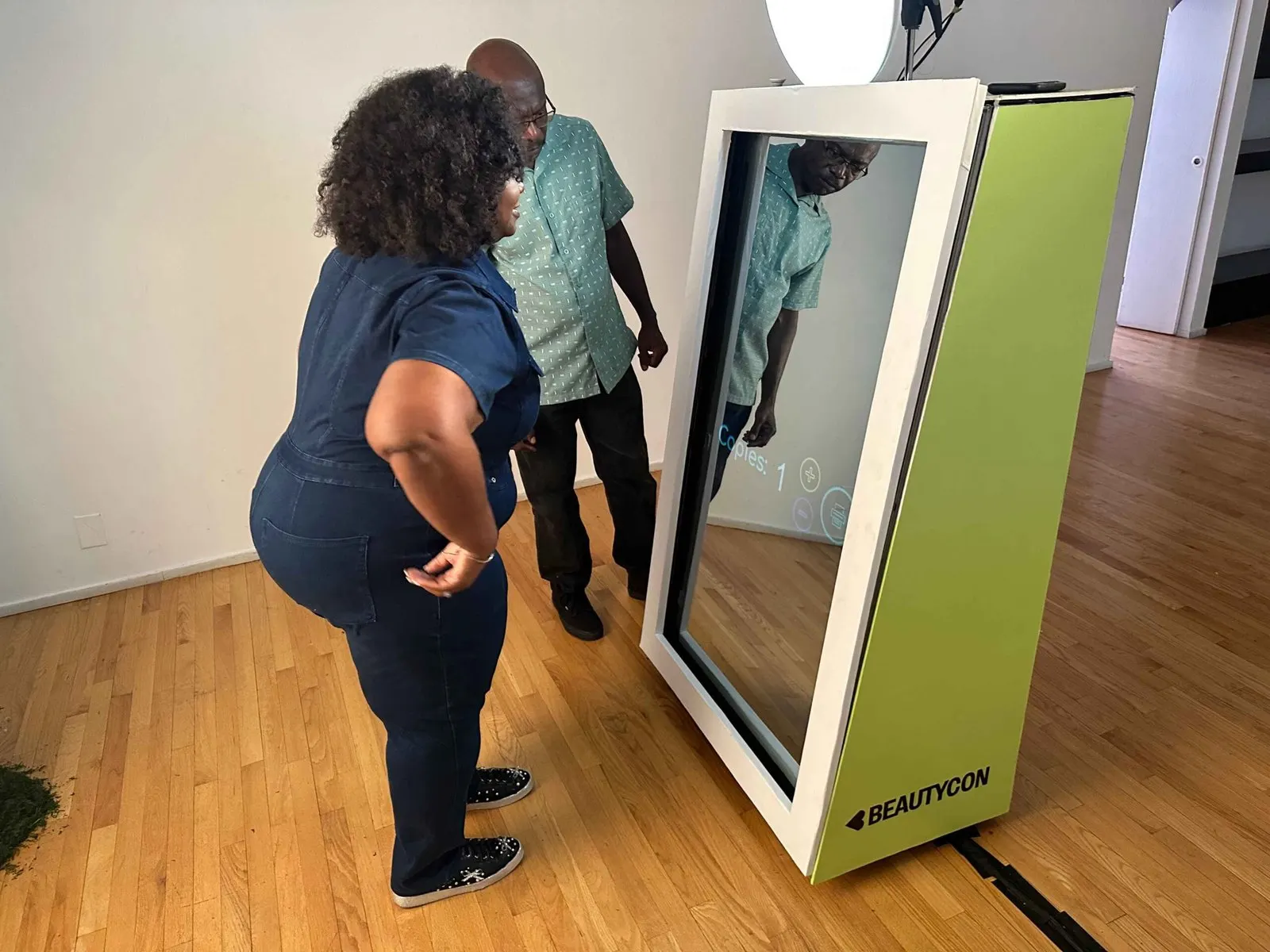 Attendees collecting branded prints at a company event