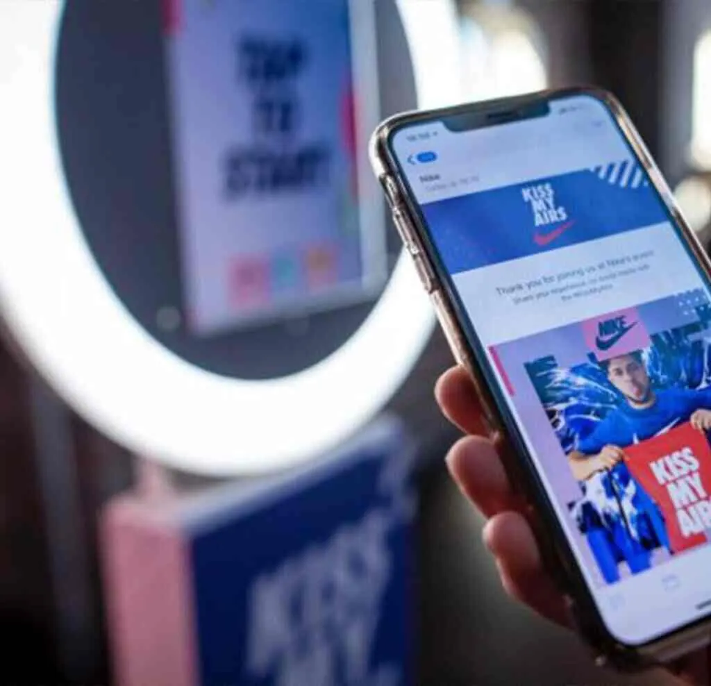 Guests posing inside a branded activation footprint