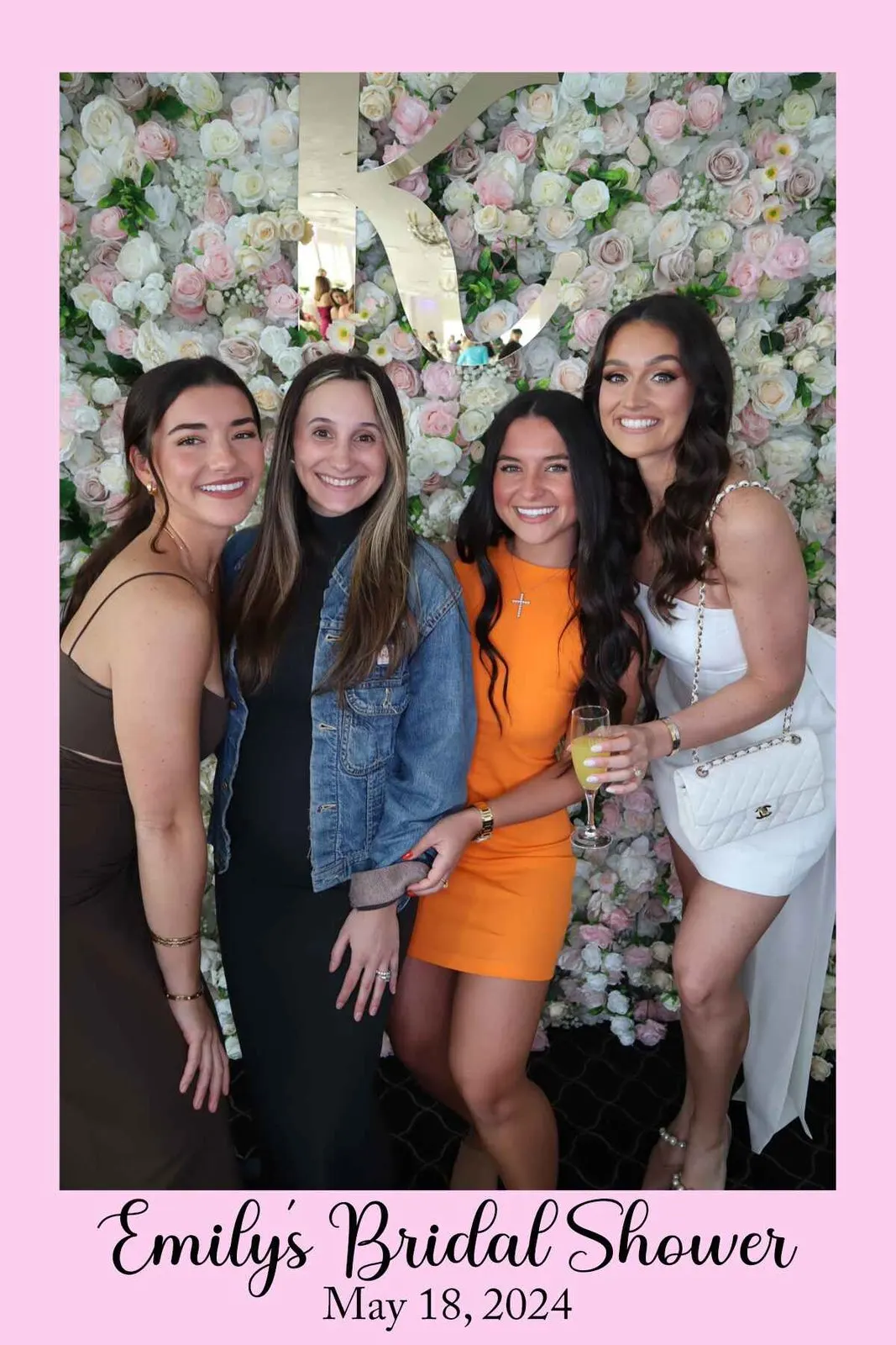 Guests taking glasses from a champagne wall