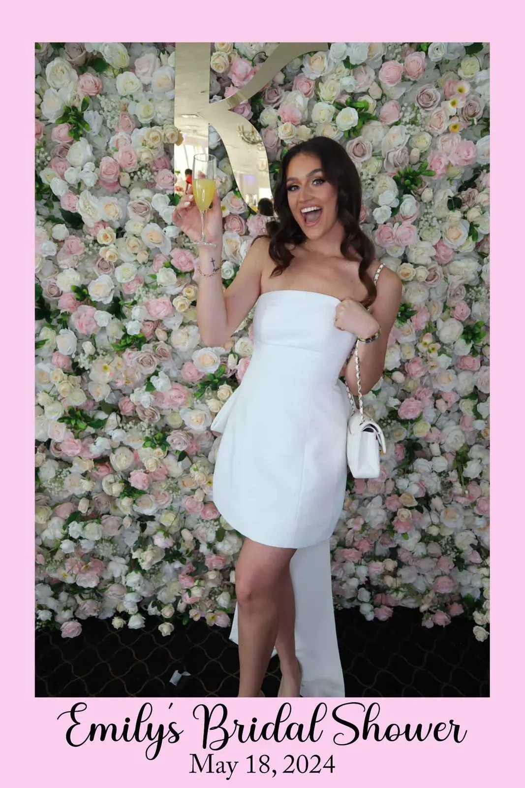 Champagne wall with filled glasses at a wedding