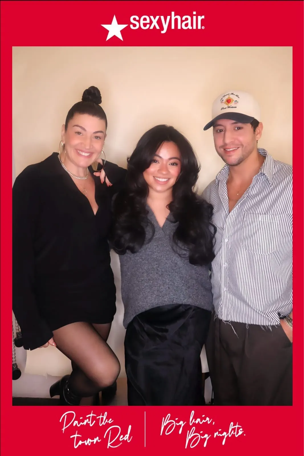 Three SexyHair team members posing together, one in a striped cap