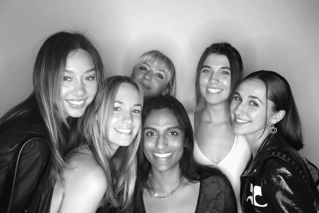 Guests posing in the glam booth at a gala