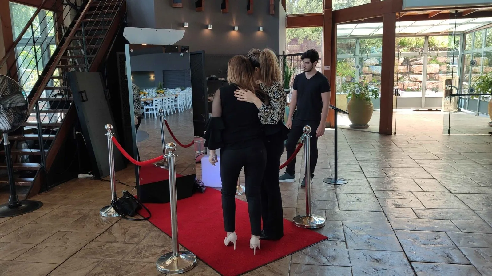 Guest signing their print on the magic mirror screen