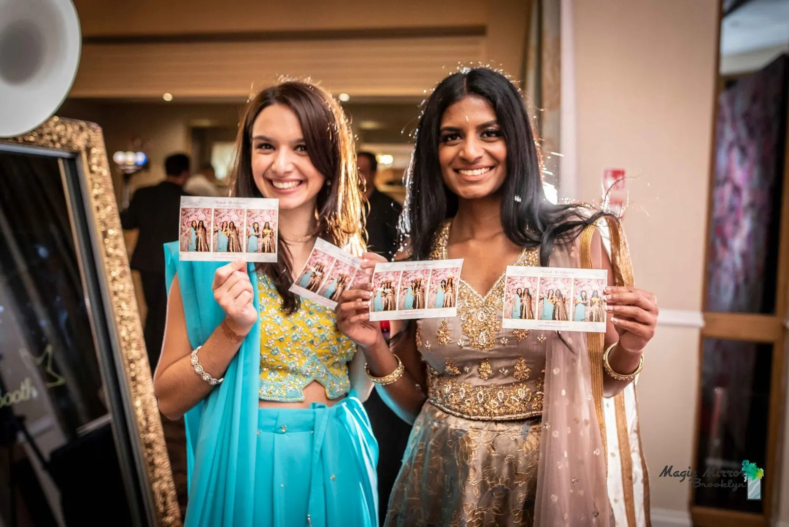 Guests collecting their prints beside the mirror booth
