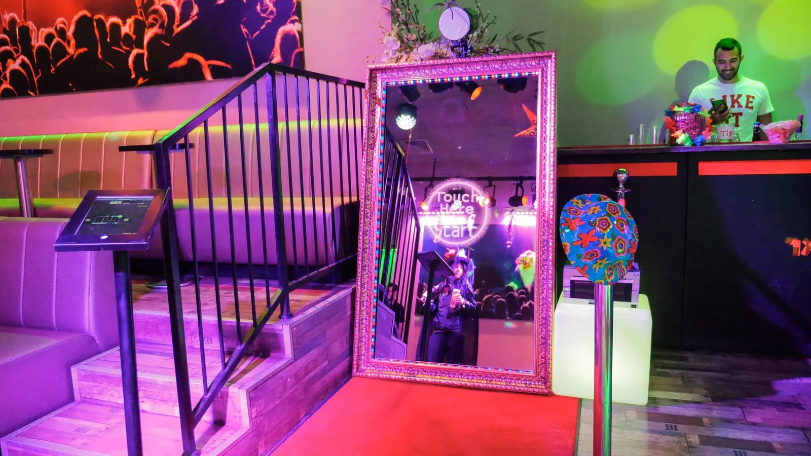 Guests posing at a full length magic mirror photo booth