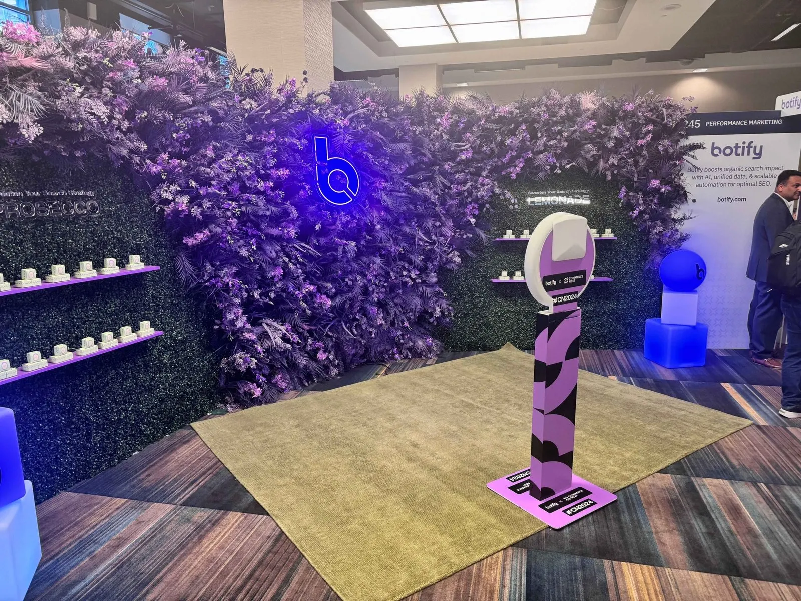Attendees at a branded photo experience on an exhibition floor